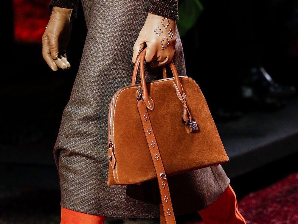 Reference image illustrating Hermès Fall 2018 Runway: Autumnal Hues, Exotic Leathers, and Retro Frame Clutches
