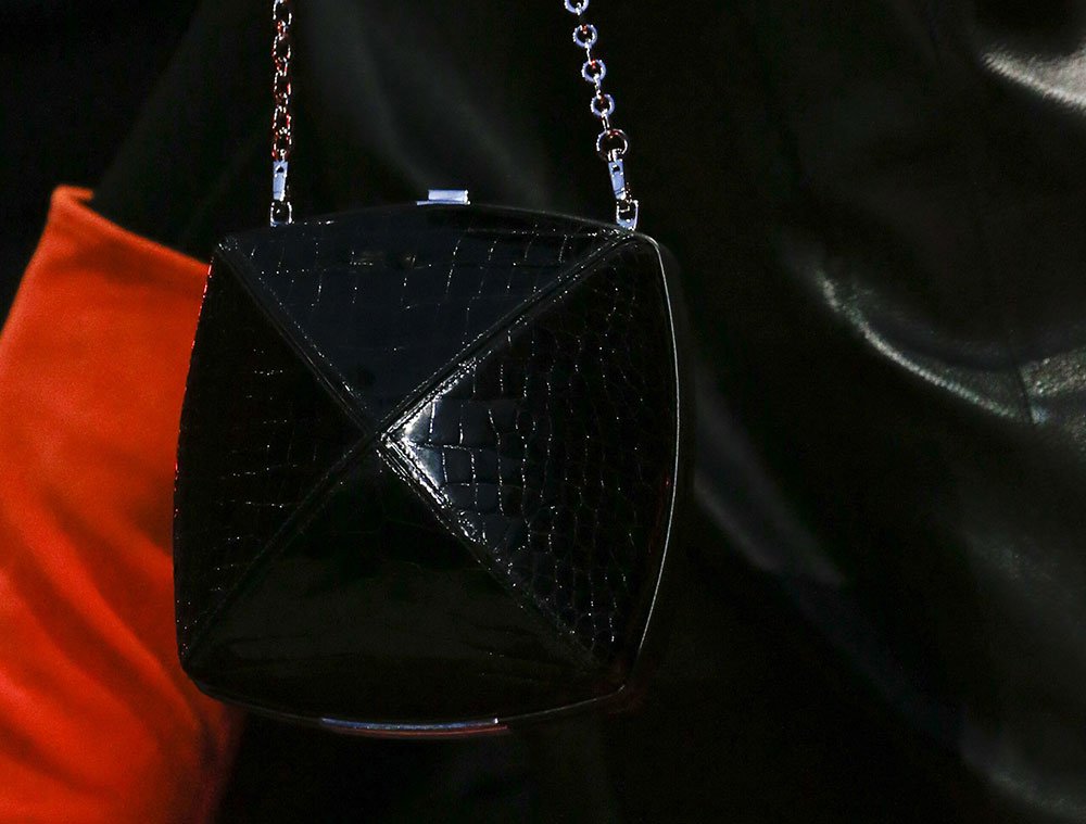 Reference image illustrating Hermès Fall 2018 Runway: Autumnal Hues, Exotic Leathers, and Retro Frame Clutches