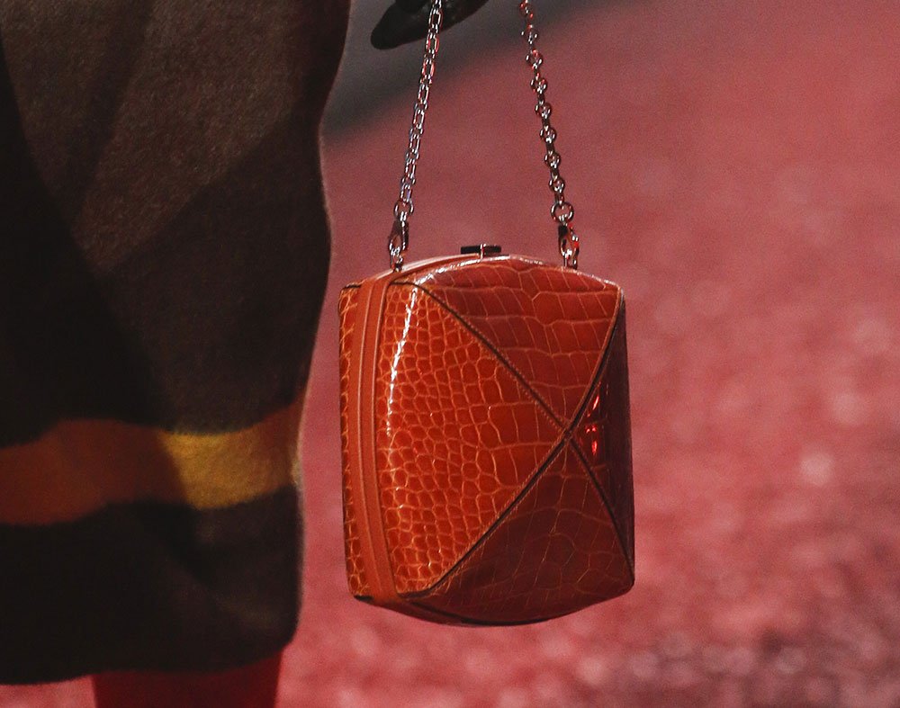 Reference image illustrating Hermès Fall 2018 Runway: Autumnal Hues, Exotic Leathers, and Retro Frame Clutches