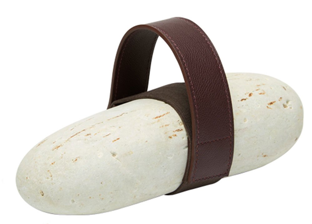 Reference image illustrating Hermès Galet Paperweight Review: An $840 Rock with a Leather Strap