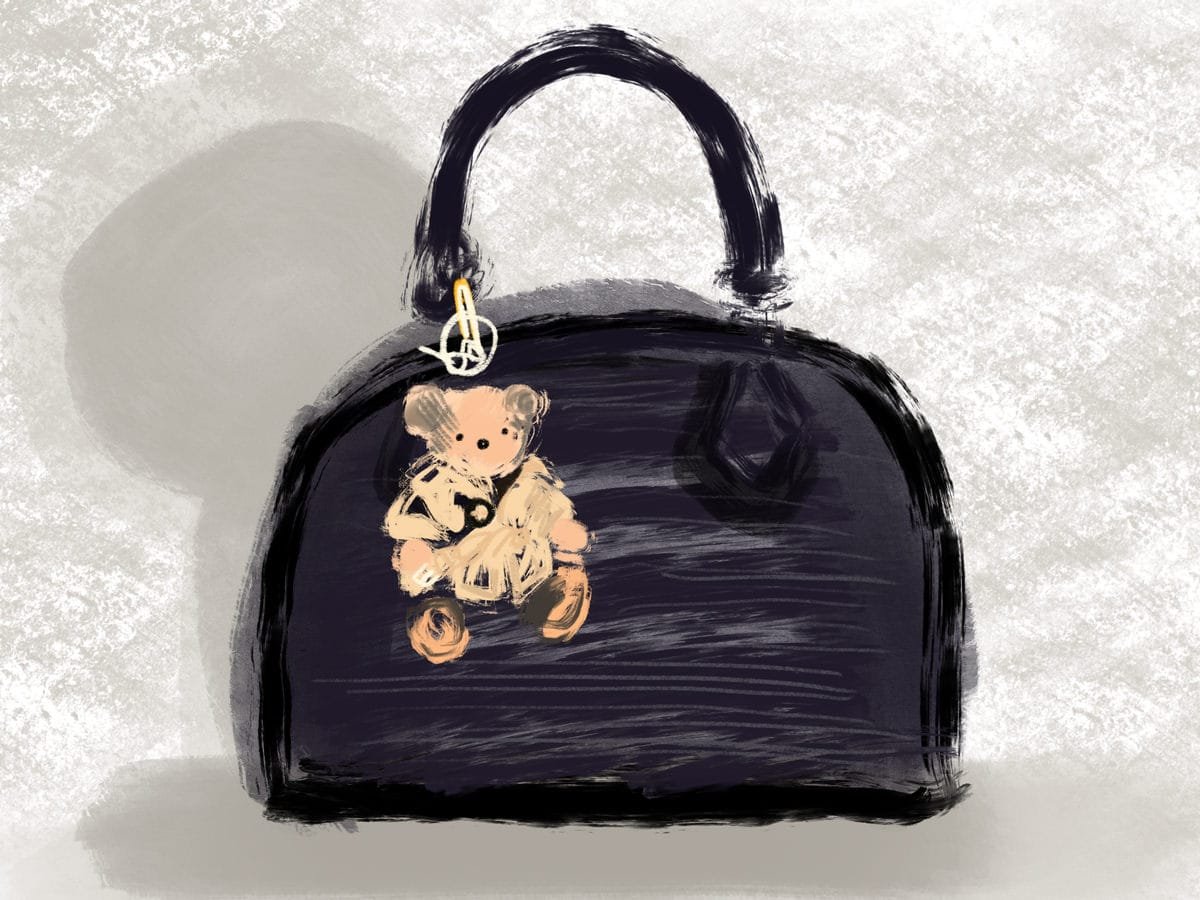 Reference image illustrating How to Elevate Your Luxury Handbag with Scarves and Charms: A Style Guide