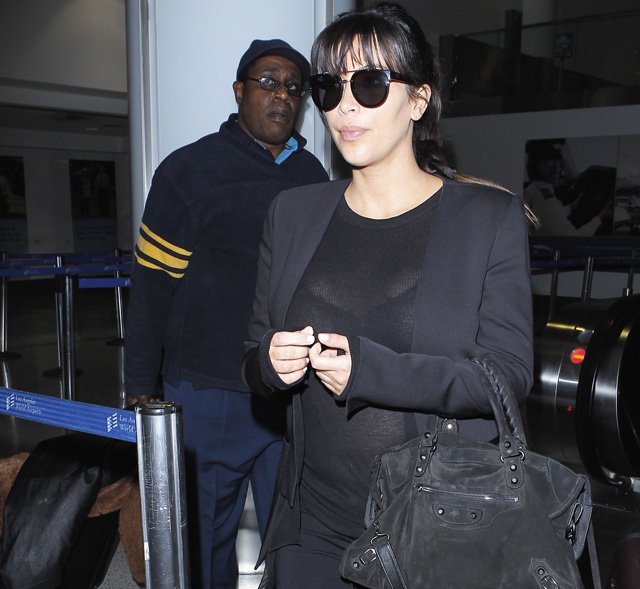 Reference image illustrating Kim Kardashian’s All-Black Airport Look: Balenciaga City Bag and Givenchy Sandals