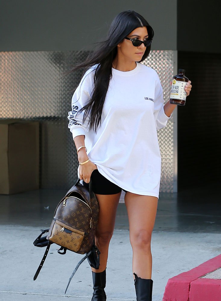 Reference image illustrating Kourtney Kardashian’s Mini Backpack Obsession: Louis Vuitton & Prada Styles She Wears on Repeat