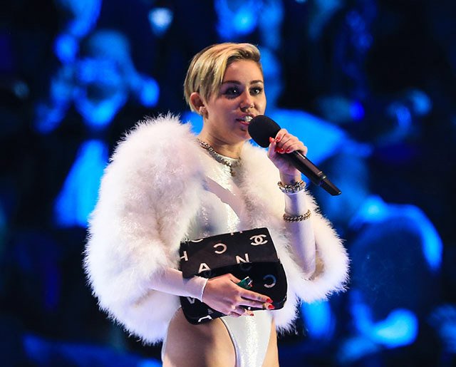 Reference image illustrating Miley Cyrus's Vintage Chanel and Designer Handbag Collection: A Style Analysis