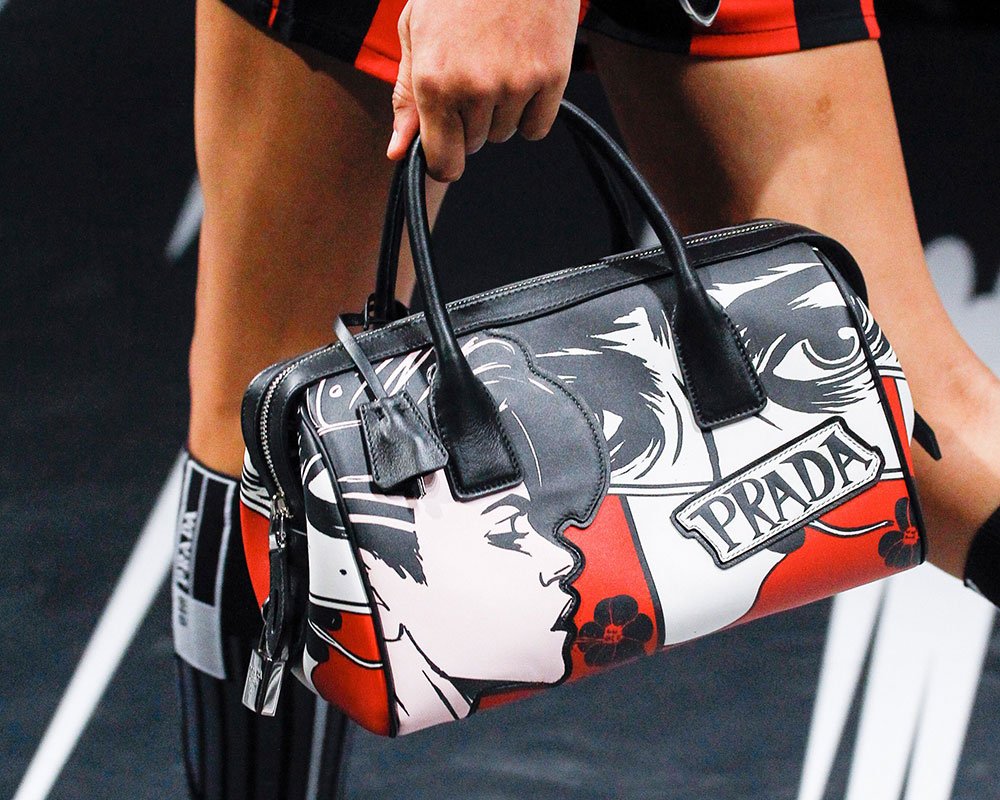 Reference image illustrating Prada Spring 2018 Runway Bags: Nylon, Comic Heroines, and Punk Details