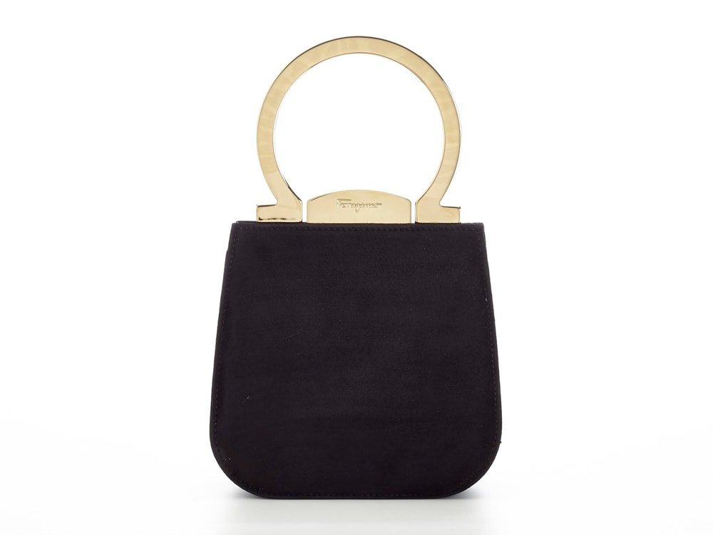 Reference image illustrating Salvatore Ferragamo Creations Black Satin Pochette: A Gancini Icon Spotted on Naomi Watts