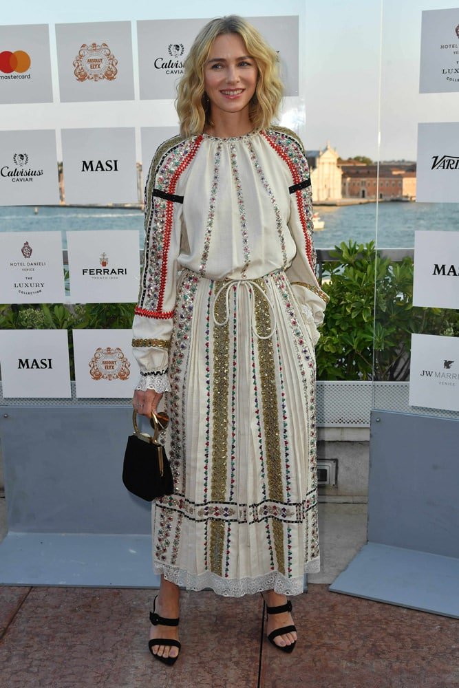 Reference image illustrating Salvatore Ferragamo Creations Black Satin Pochette: A Gancini Icon Spotted on Naomi Watts