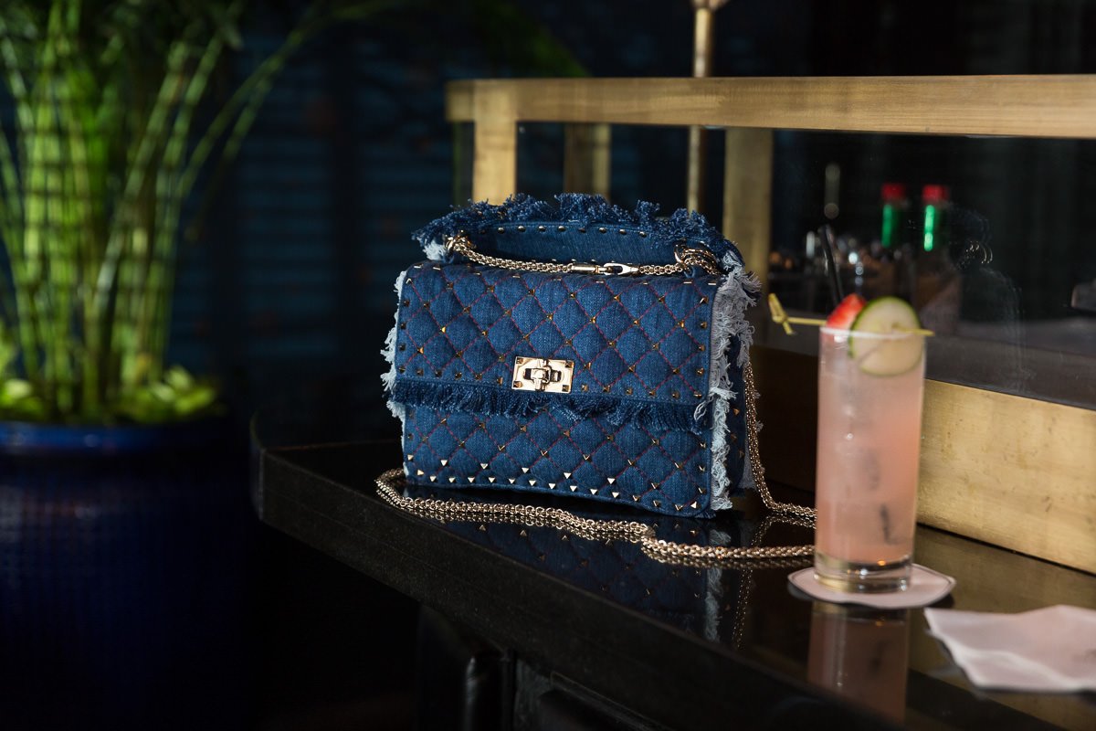Reference image illustrating Valentino Rockstud Spike Chain Bag in Denim: A Fresh Take on a Luxury Icon