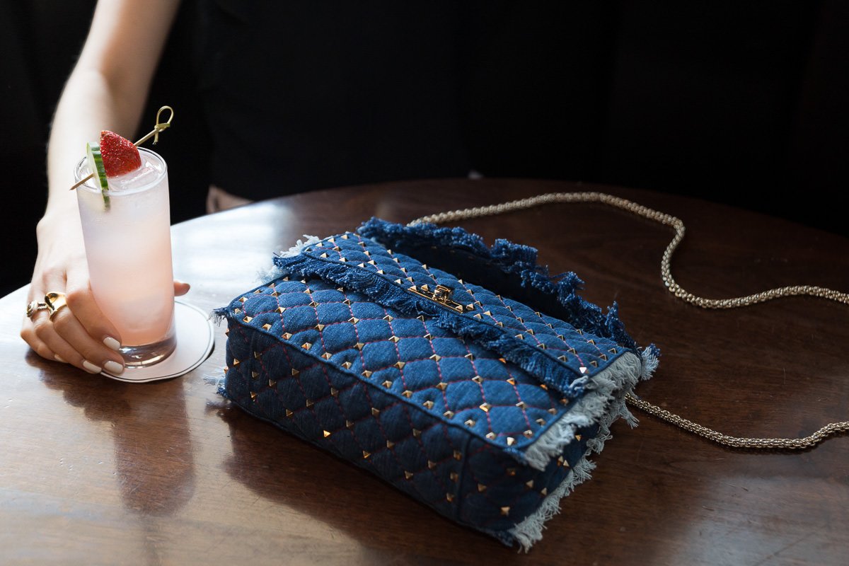 Reference image illustrating Valentino Rockstud Spike Chain Bag in Denim: A Fresh Take on a Luxury Icon