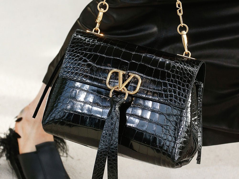 Reference image illustrating Valentino Spring 2019 Handbags: A New Logo Hardware Era Without Rockstuds