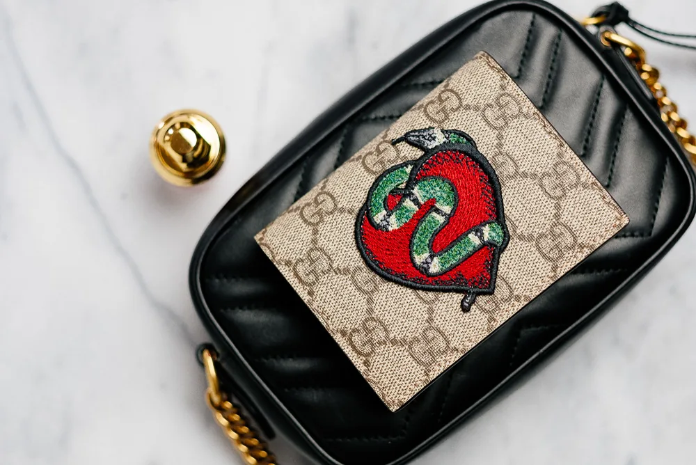 Reference image illustrating What Fits Inside the Gucci GG Marmont Mini Matelassé Camera Bag: A Real-Life Packing Test
