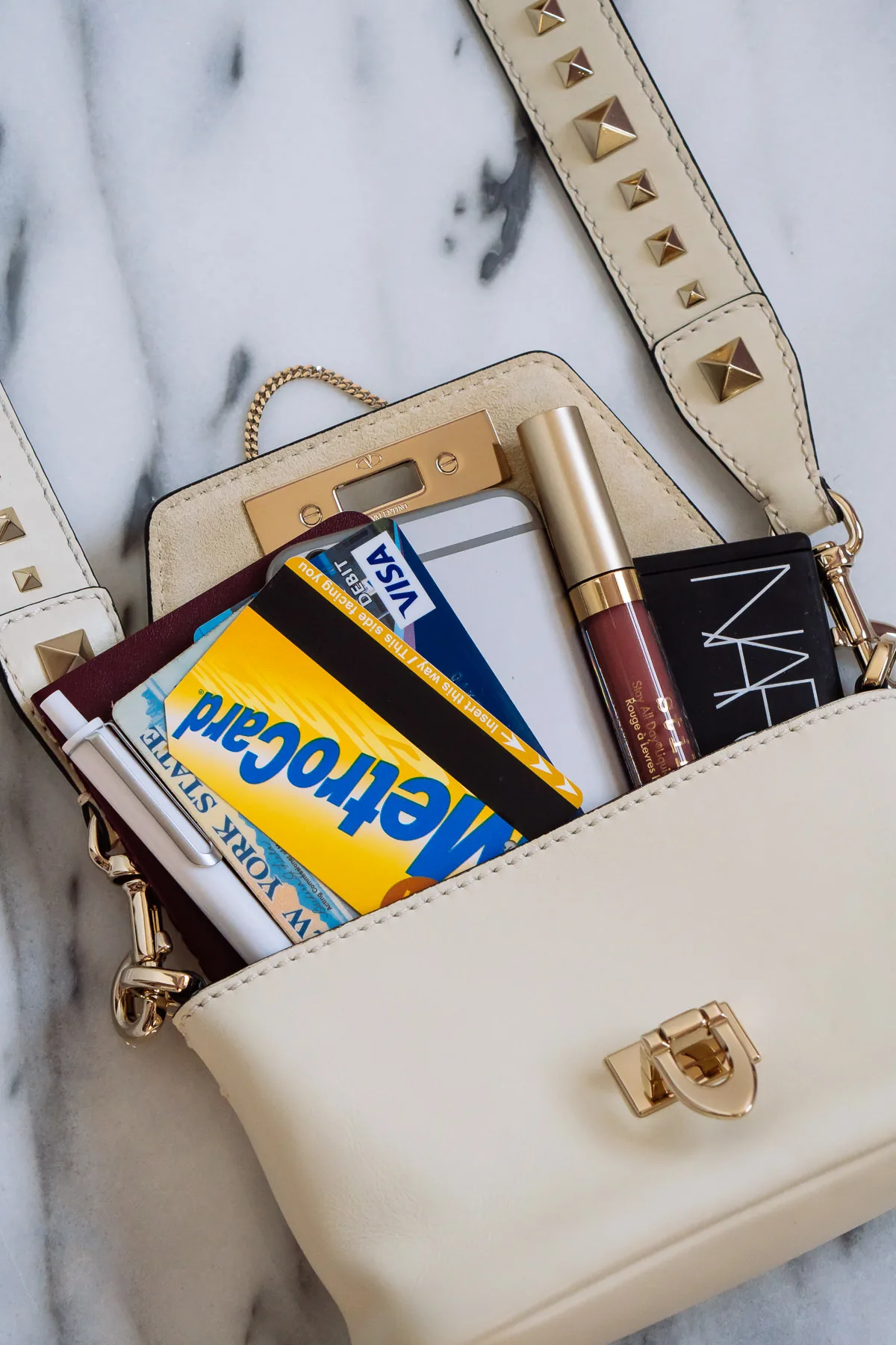 Reference image illustrating Why the Valentino Demilune Small Crossbody in Winter White Is Worth Breaking Your No-White Rule