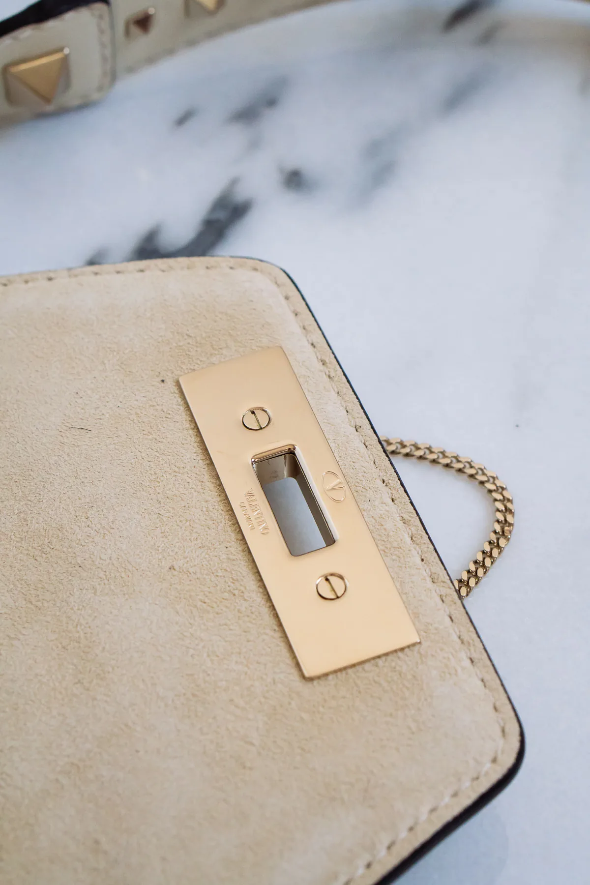 Reference image illustrating Why the Valentino Demilune Small Crossbody in Winter White Is Worth Breaking Your No-White Rule