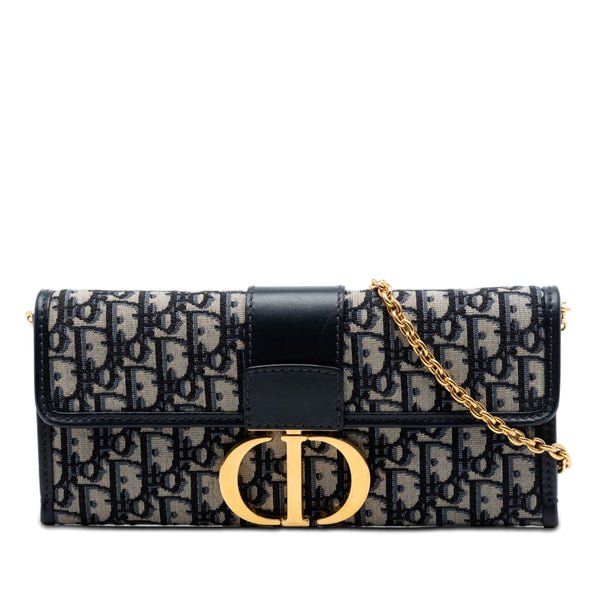 Reference image illustrating Christian Dior 30 Montaigne Clutch Oblique Canvas: A Timeless Icon of Parisian Elegance
