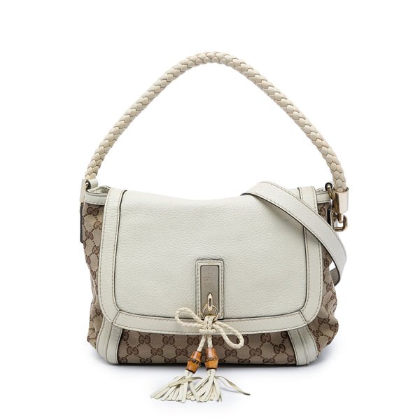 Reference image illustrating Gucci Bella Flap Shoulder Bag GG Canvas with Leather Medium: A Timeless Icon Reimagined